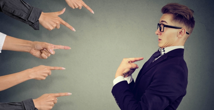 Blaming you. Anxious man judged by different people pointing fingers at him. Negative human emotions feeling